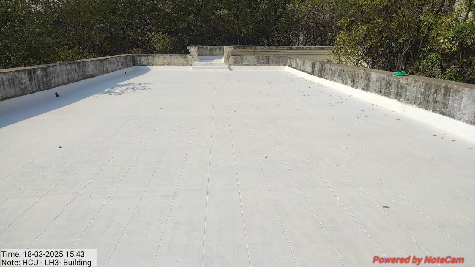 Finished white cool-roof treatment on the roof of the LH3 building, March 2025